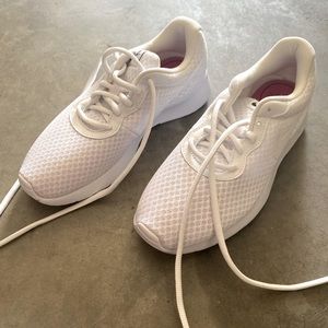 All white Nike shoes